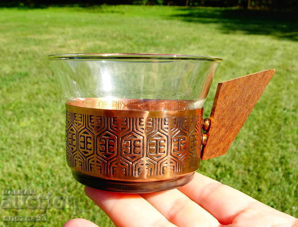 A copper cup with a thermoset.