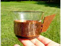 A copper cup with a thermoset.