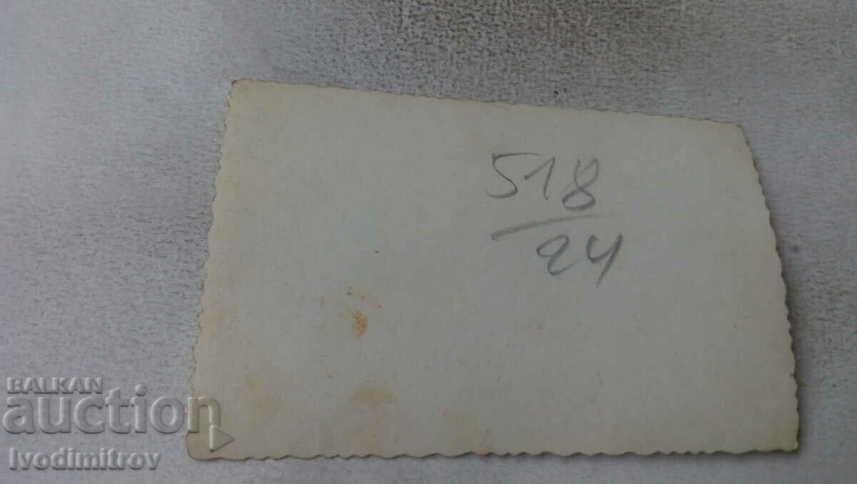 Photo Sofia Two men and a woman with bouquets of flowers with price 2.35 BGN | € 1.20