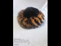 Stylish women's hat made of genuine leather of an exotic animal