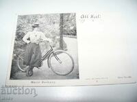 An old German card with actress Marie Barkany on a bicycle