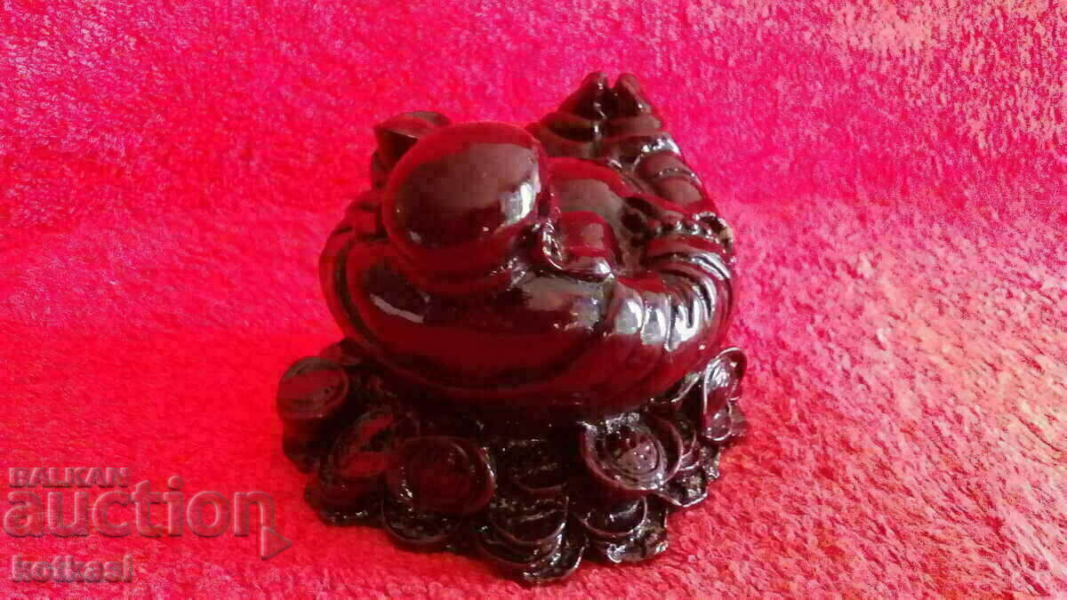 Auction  Buddha is a solid massive figure