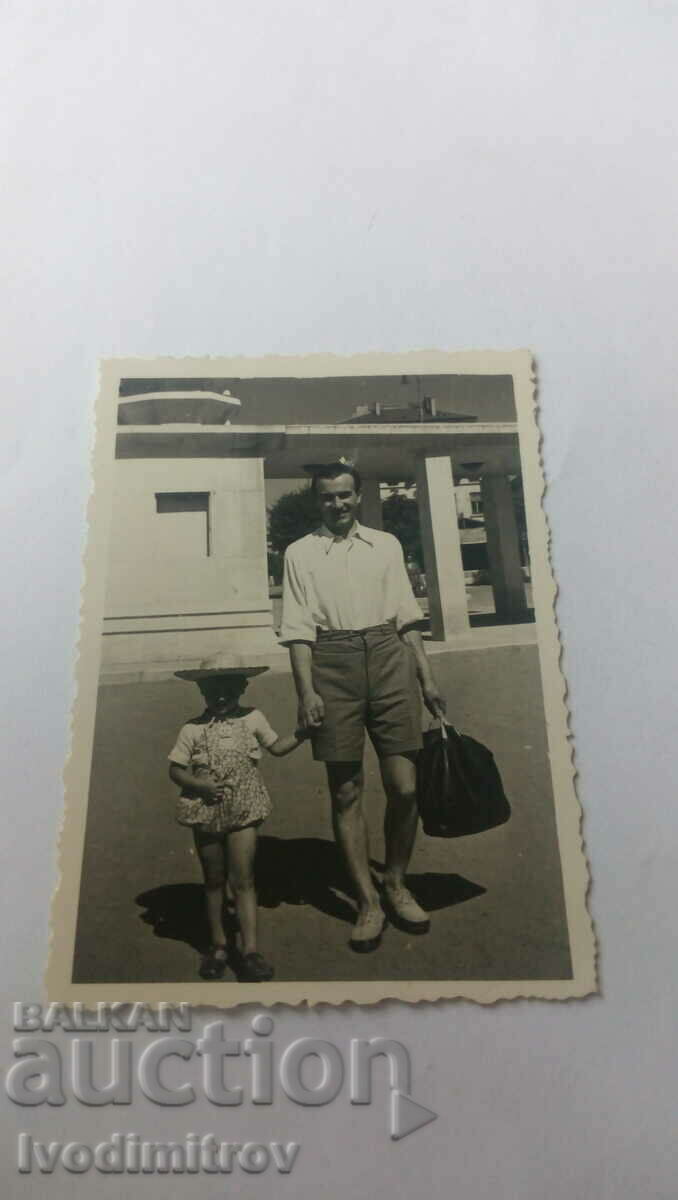 Photo of a man and a little boy on a walk