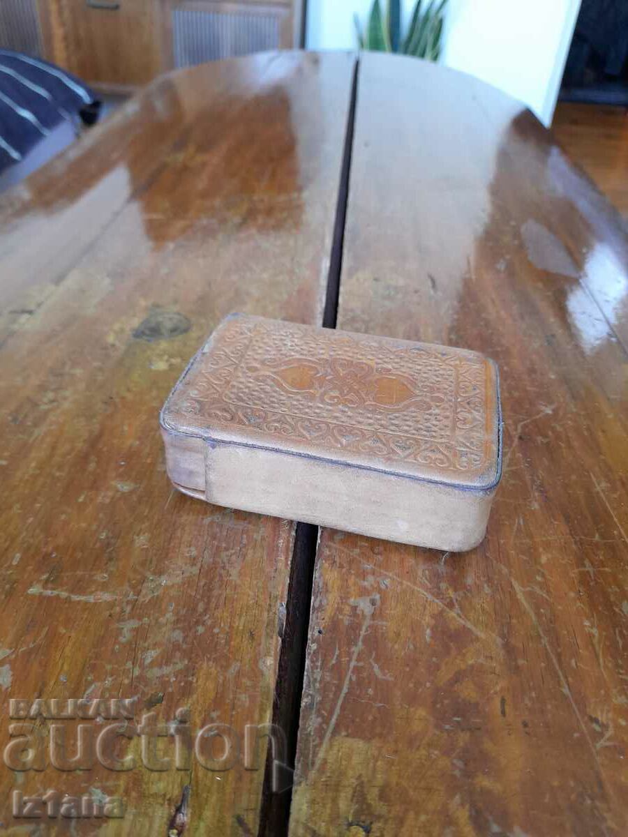 An old leather card case