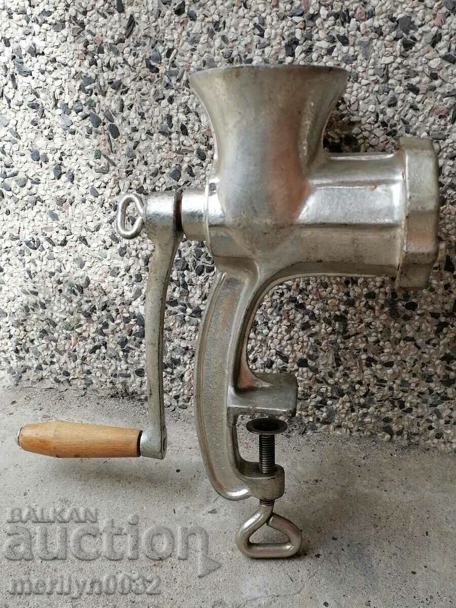 An old metal grinder for meat grinders