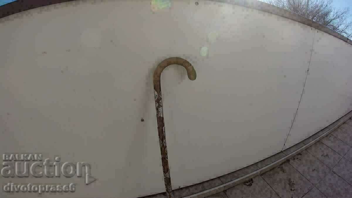 A wooden cane A wooden cane