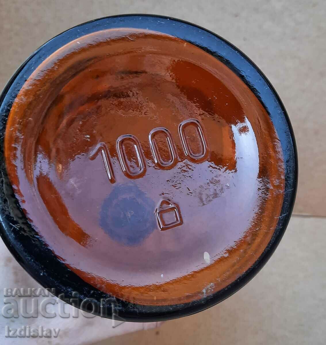 Auction Antique amber glass bottle part of a collection Auction Antique amber glass bottle part of a collection