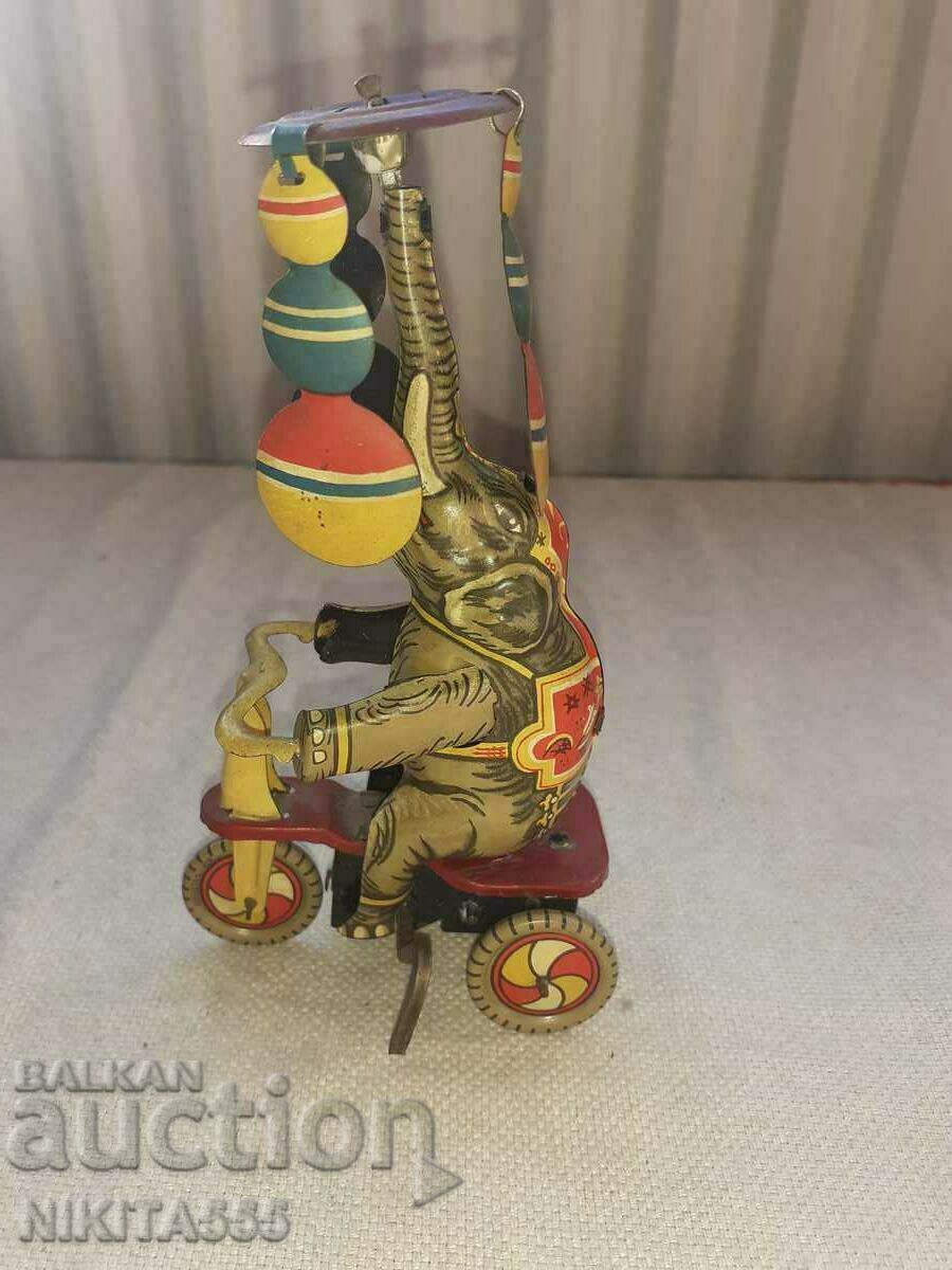 Auction Rare tin toy - Elephant on Bike Tricycle Auction Rare tin toy - Elephant on Bike Tricycle
