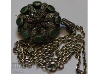 Old silver locket with rubies and emeralds