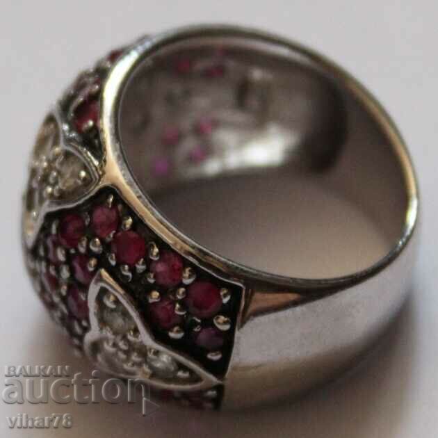Auction Solid silver ring studded with natural rubies and zircon Auction Solid silver ring studded with natural rubies and zircon
