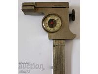 Old caliper with indicator