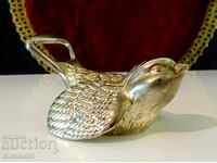 Silver-plated opener and closure Bird.