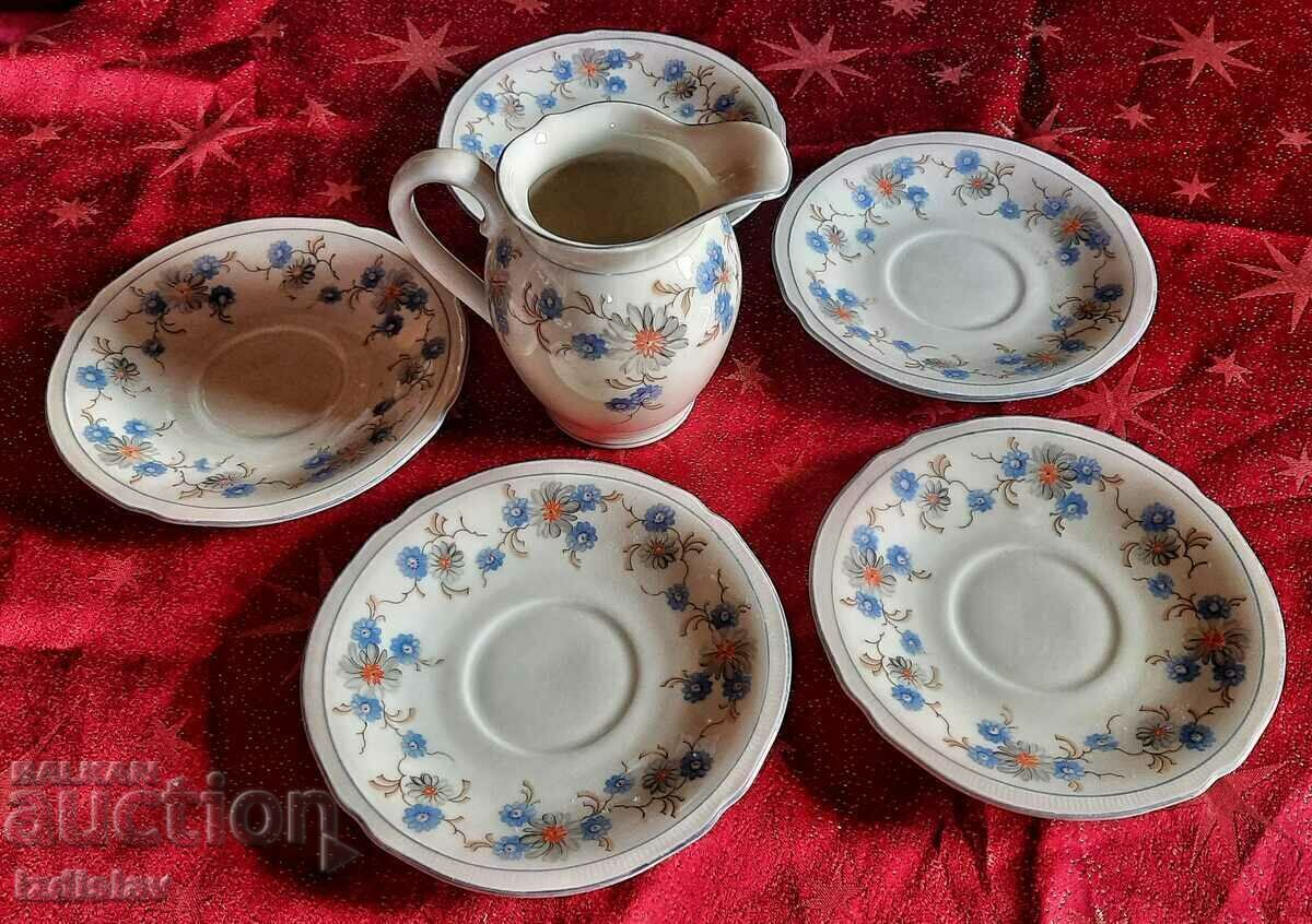 Cream jug and five plates