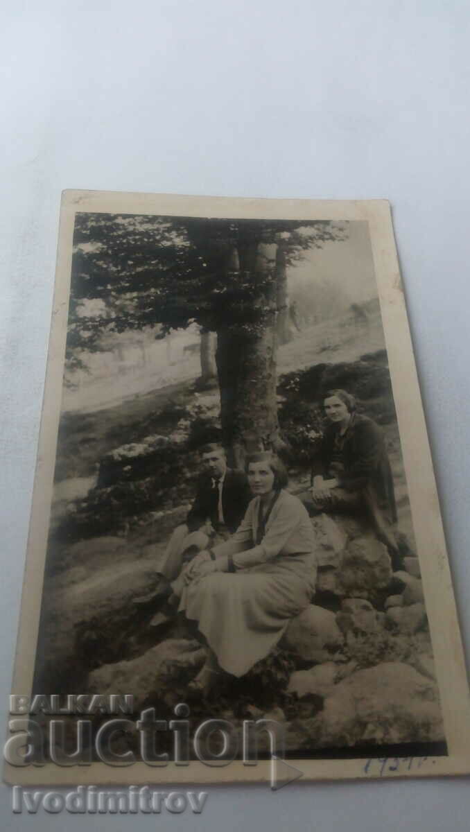 Photo of a man and two young women on the stones 1934