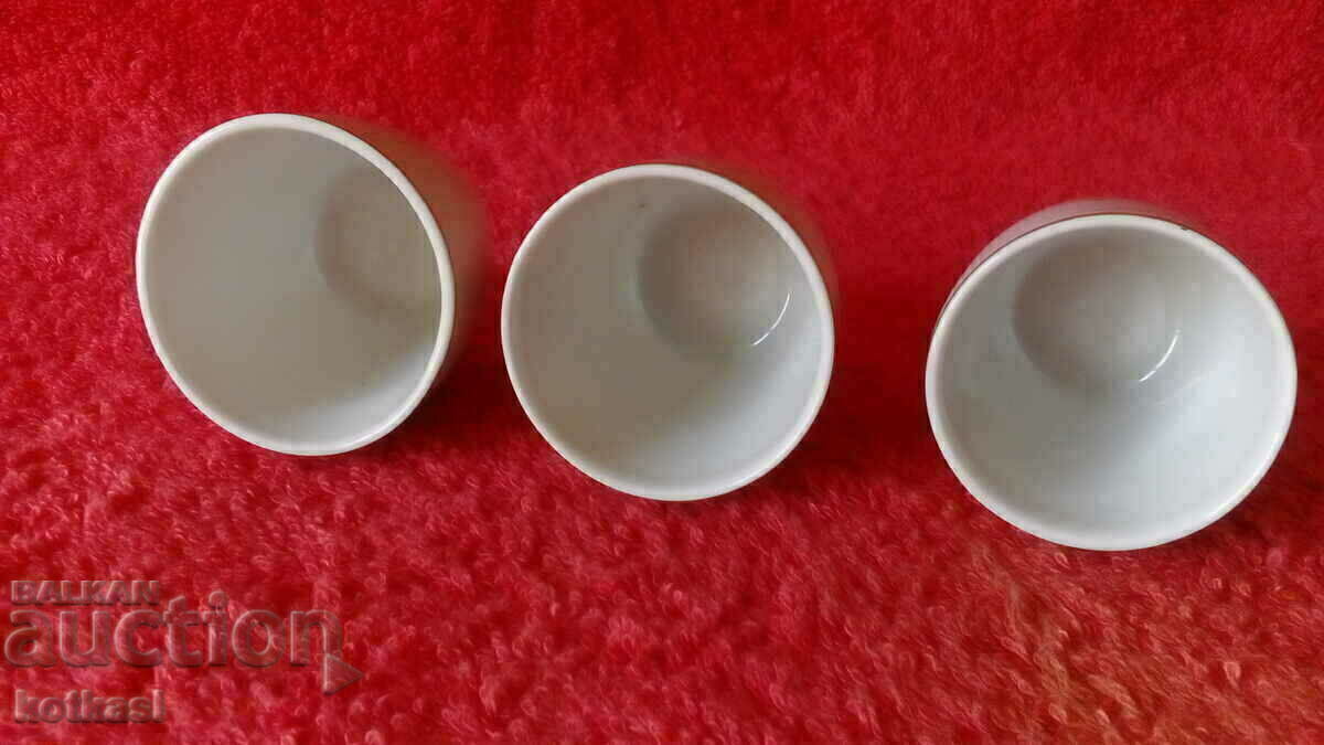 Auction Lot 3 old porcelain brandy glasses marked with gold edging Auction Lot 3 old porcelain brandy glasses marked with gold edging