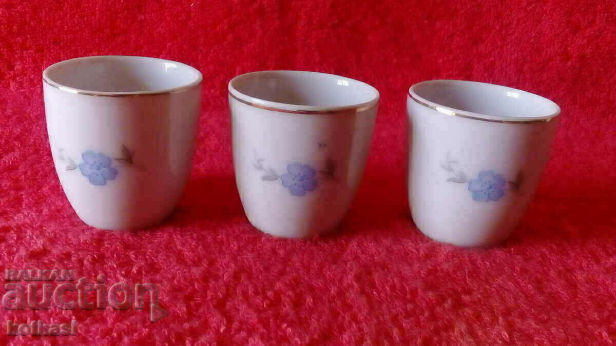Lot 3 old porcelain brandy glasses marked with gold edging Lot 3 old porcelain brandy glasses marked with gold edging