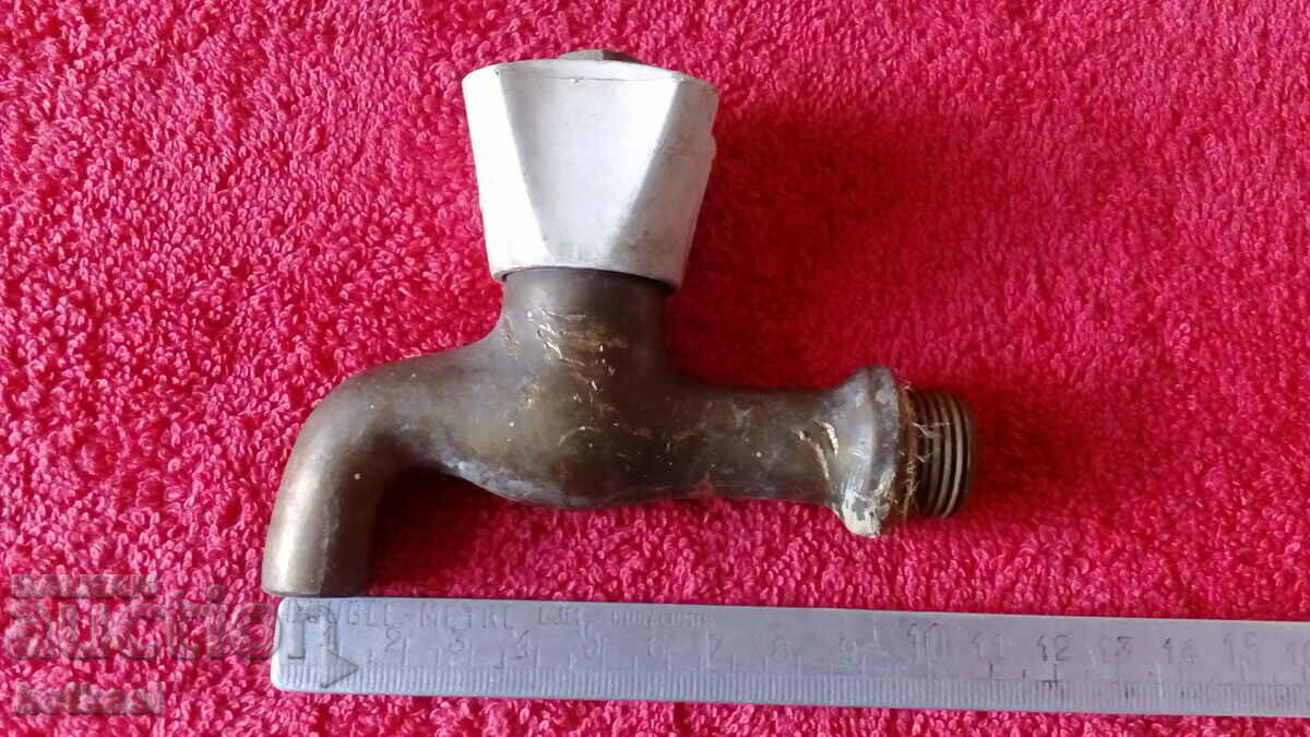 Old bronze faucet spout fountain Old bronze faucet spout fountain