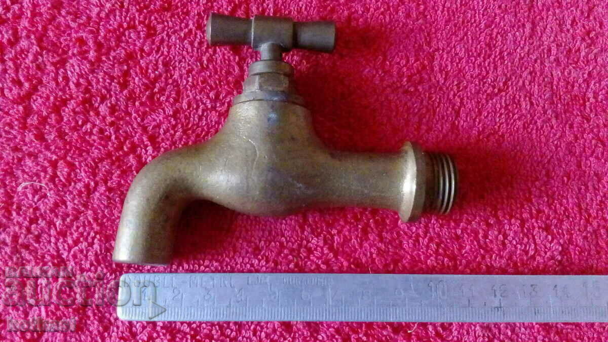 Old bronze faucet spout fountain Old bronze faucet spout fountain