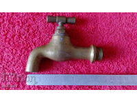 Old bronze faucet spout fountain