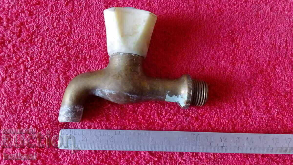 Old bronze faucet spout fountain Old bronze faucet spout fountain