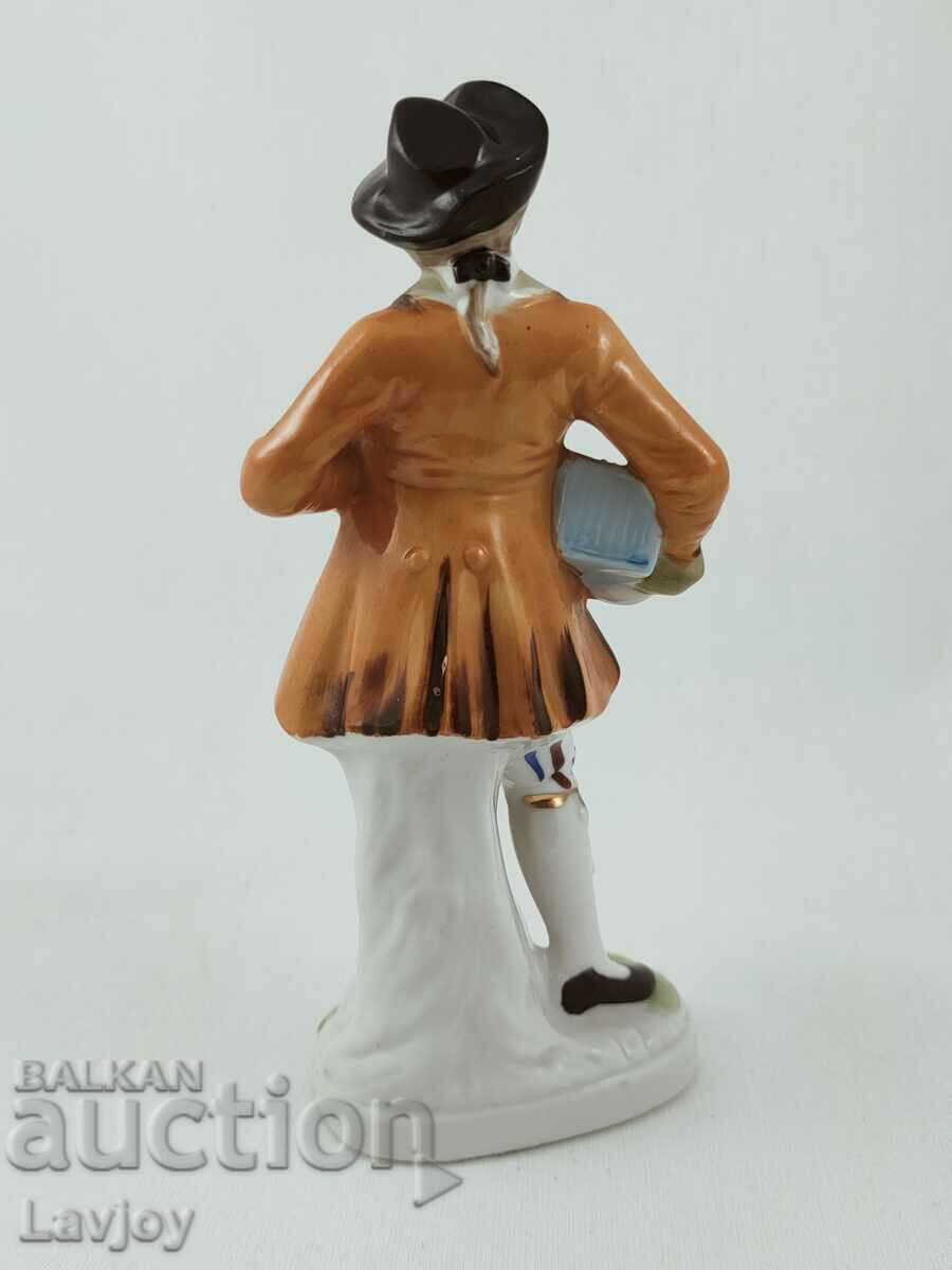 Auction Old porcelain figurine of a gentleman Auction Old porcelain figurine of a gentleman