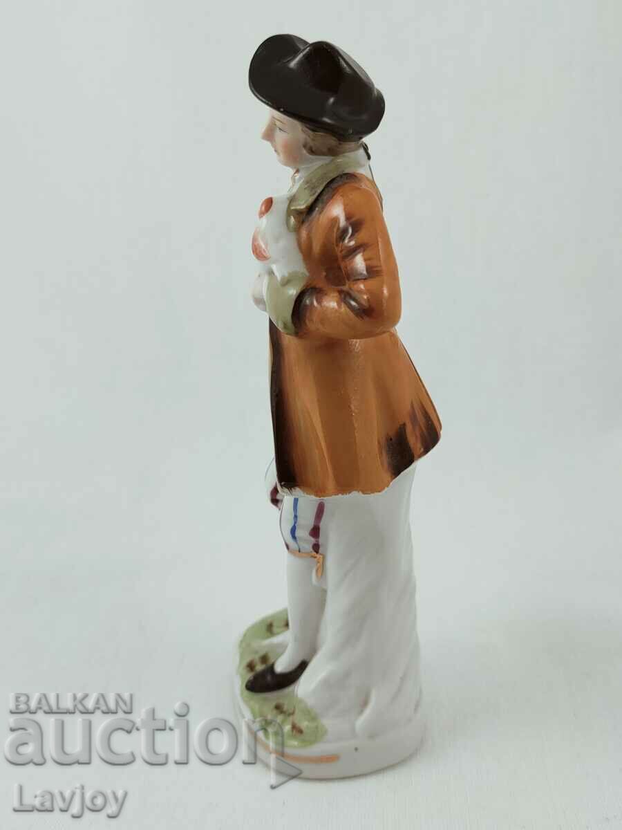 Delivery of Old porcelain figurine of a gentleman Delivery of Old porcelain figurine of a gentleman