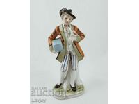 Old porcelain figurine of a gentleman