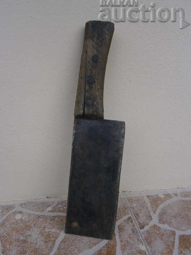 A hand forged ax, a pole, a chopper, a wrought iron, a primitive