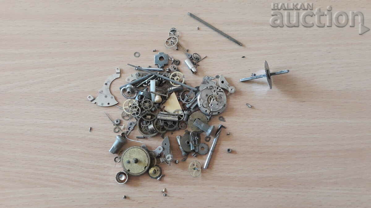 lot of parts from an old watchmaker's box