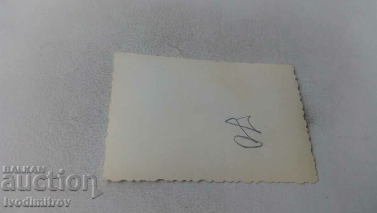 Photo A man next to a vintage PEUGEOT car with price 2.35 BGN | € 1.20 Photo A man next to a vintage PEUGEOT car with price 2.35 BGN | € 1.20