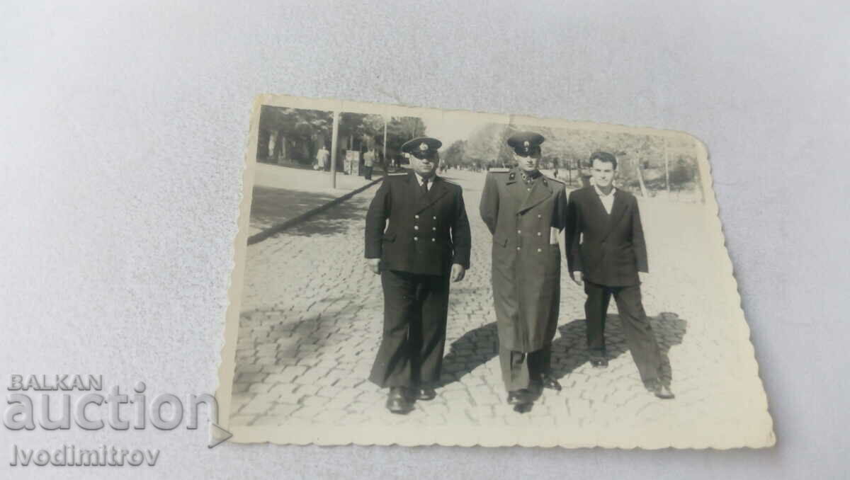 Photo Two officers and a civilian on a walk