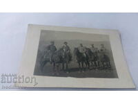 Photo Four officers and a man on horseback at the front
