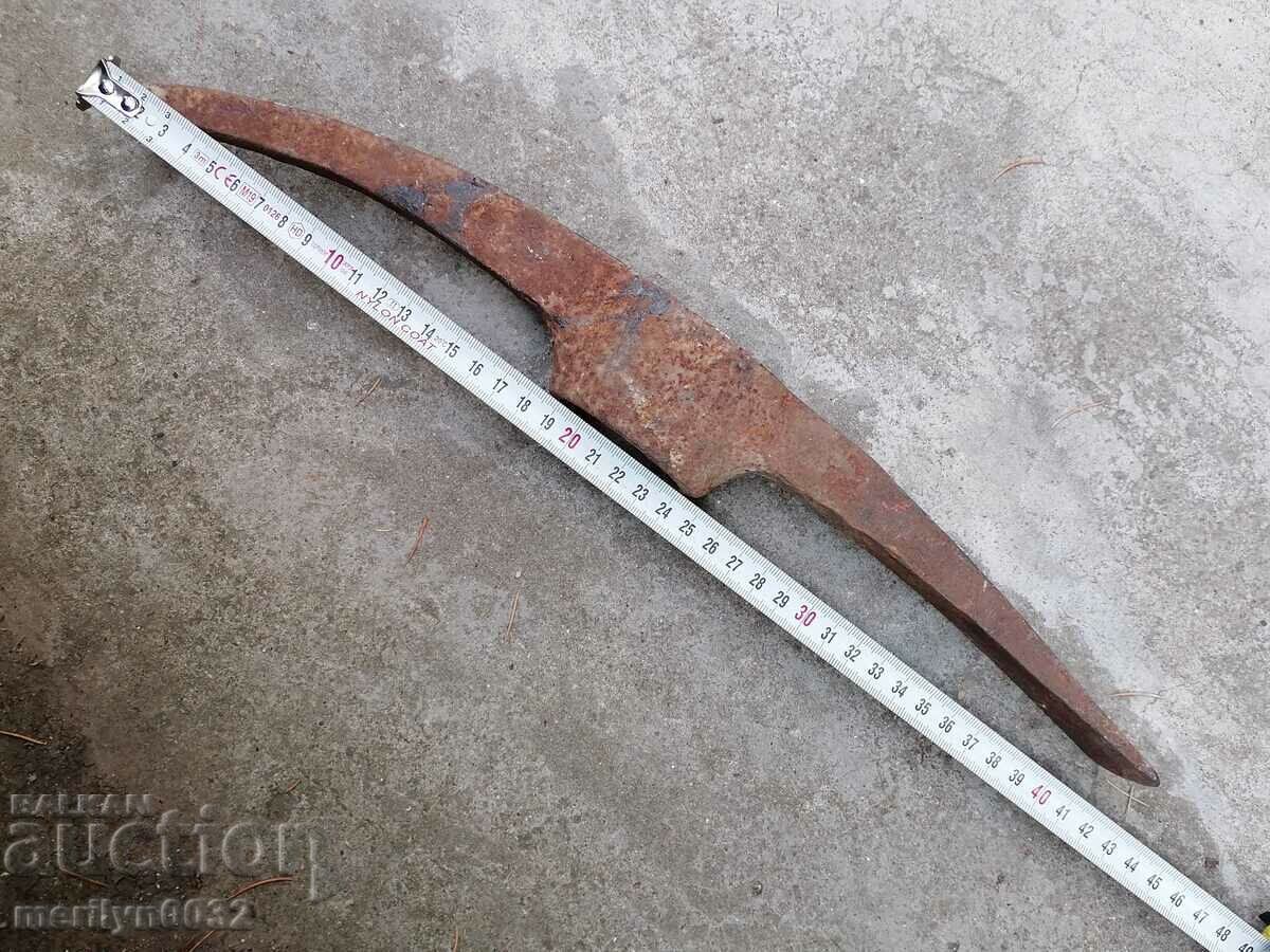 Delivery of Old hand-forged pickaxe tool wrought iron