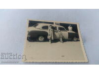 Photo Tel Aviv Man woman and baby boy next to vintage car