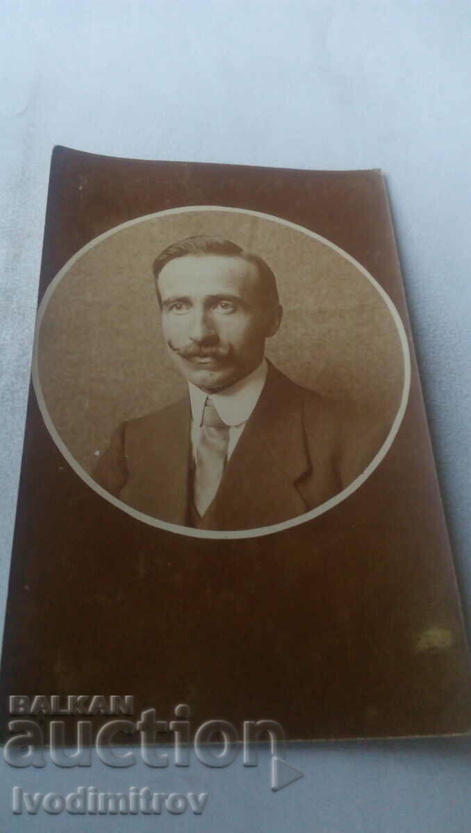 Photo of a man with a mustache