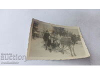 Photo Family with donkey sled in winter
