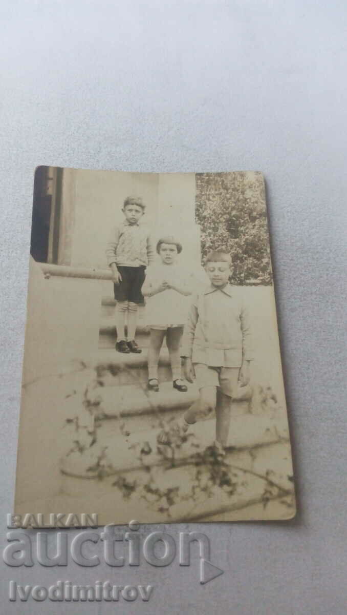 Photo Three children on stairs
