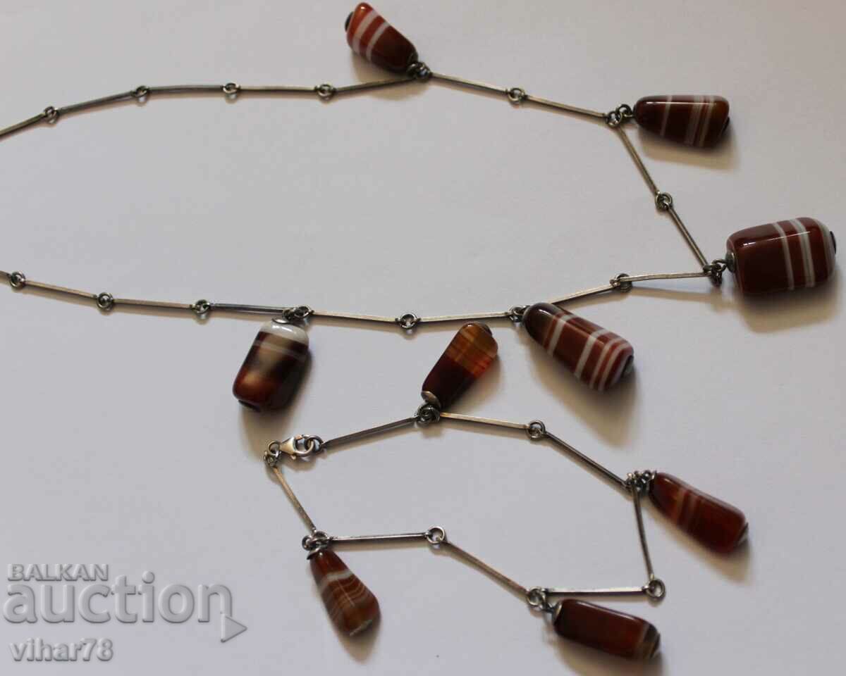 Auction SILVER NECKLACE AND BRACELET WITH CHARMS Auction SILVER NECKLACE AND BRACELET WITH CHARMS