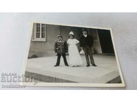 Photo Sofia A girl and two boys in front of the Soviet cult. home
