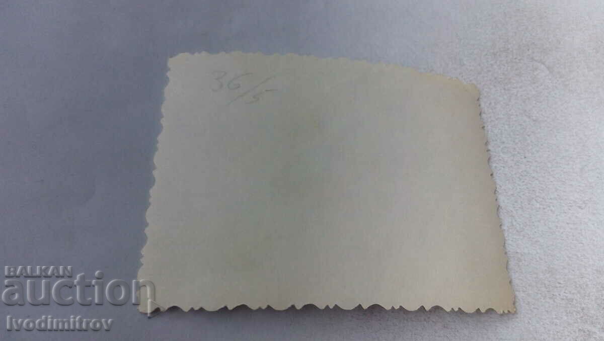 Photo Man women and children next to two parked cars with price 1.15 BGN | € 0.59 Photo Man women and children next to two parked cars with price 1.15 BGN | € 0.59