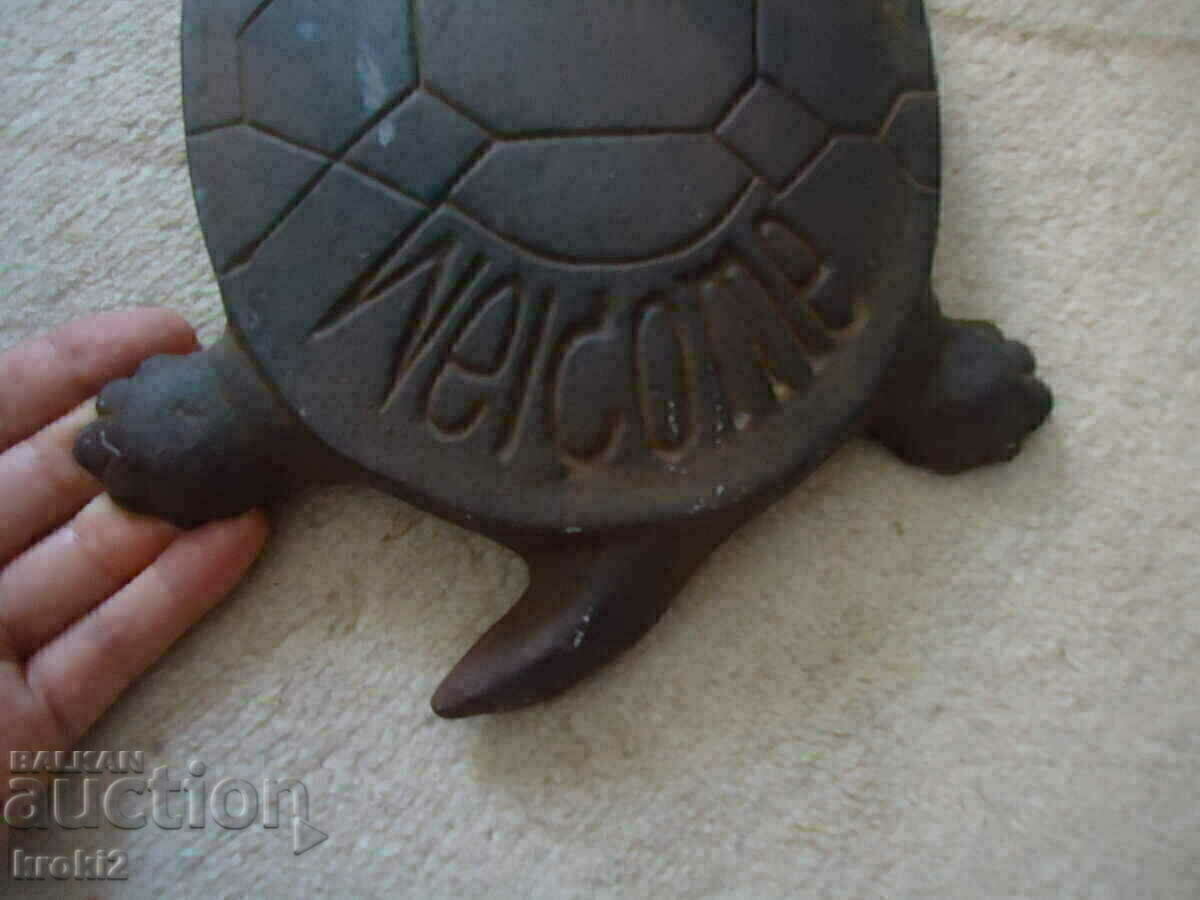 Delivery of Old Cast Iron Metal Tortoise Neck Rest Stopper