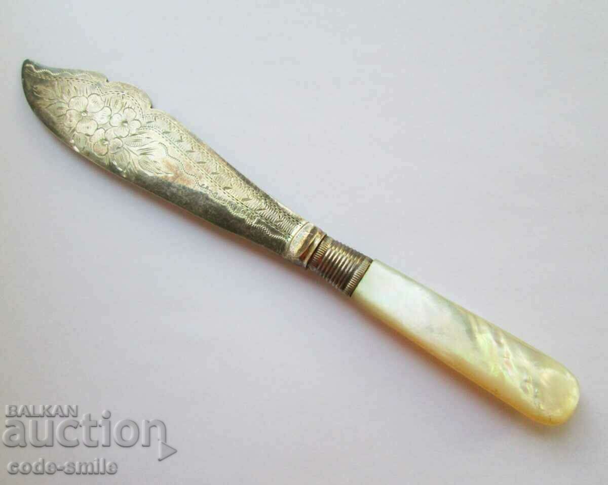 A beautiful old dining knife with engravings and mother-of-pearl handle 19c