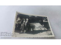 Photo Two women next to a vintage car Warsaw