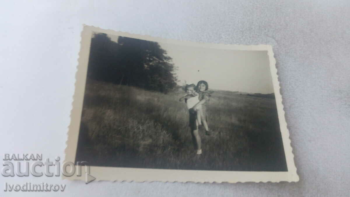 Photo Two girls on the meadow