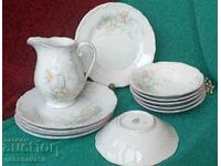 Porcelain painted bowls, plates with delicate floral motifs