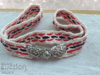 Knitted children's belt with small pleats
