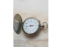 Vintage pocket watch with three flaps