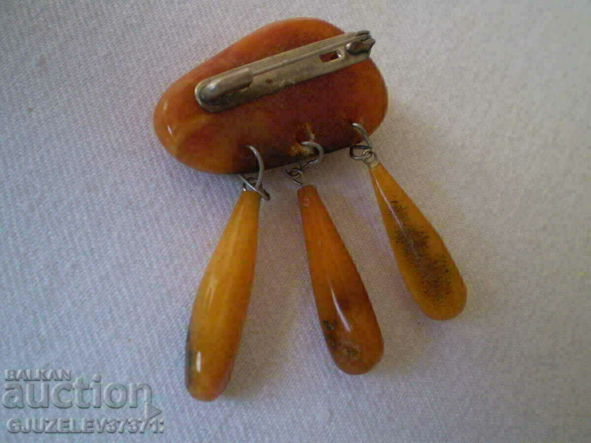 Old lady's amber brooch with price 95.00 BGN | € 48.57 Old lady's amber brooch with price 95.00 BGN | € 48.57