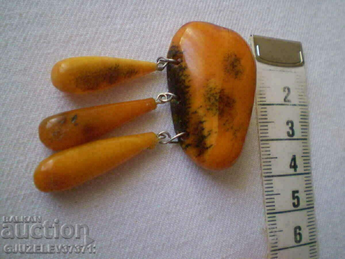 Auction Old lady's amber brooch Auction Old lady's amber brooch