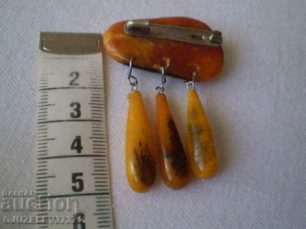 Delivery of Old lady's amber brooch Delivery of Old lady's amber brooch